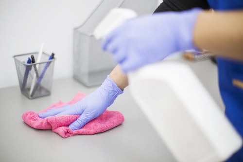 Carpet cleaning team using safety procedures in a home setting