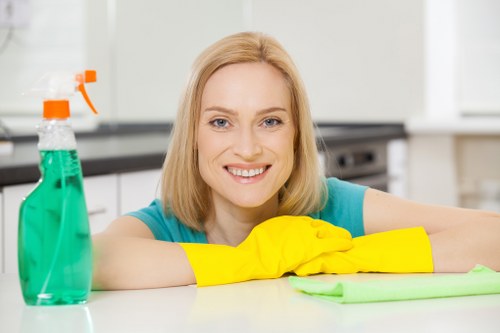 Cleaner preparing a short-let bedroom for the next Airbnb check-in